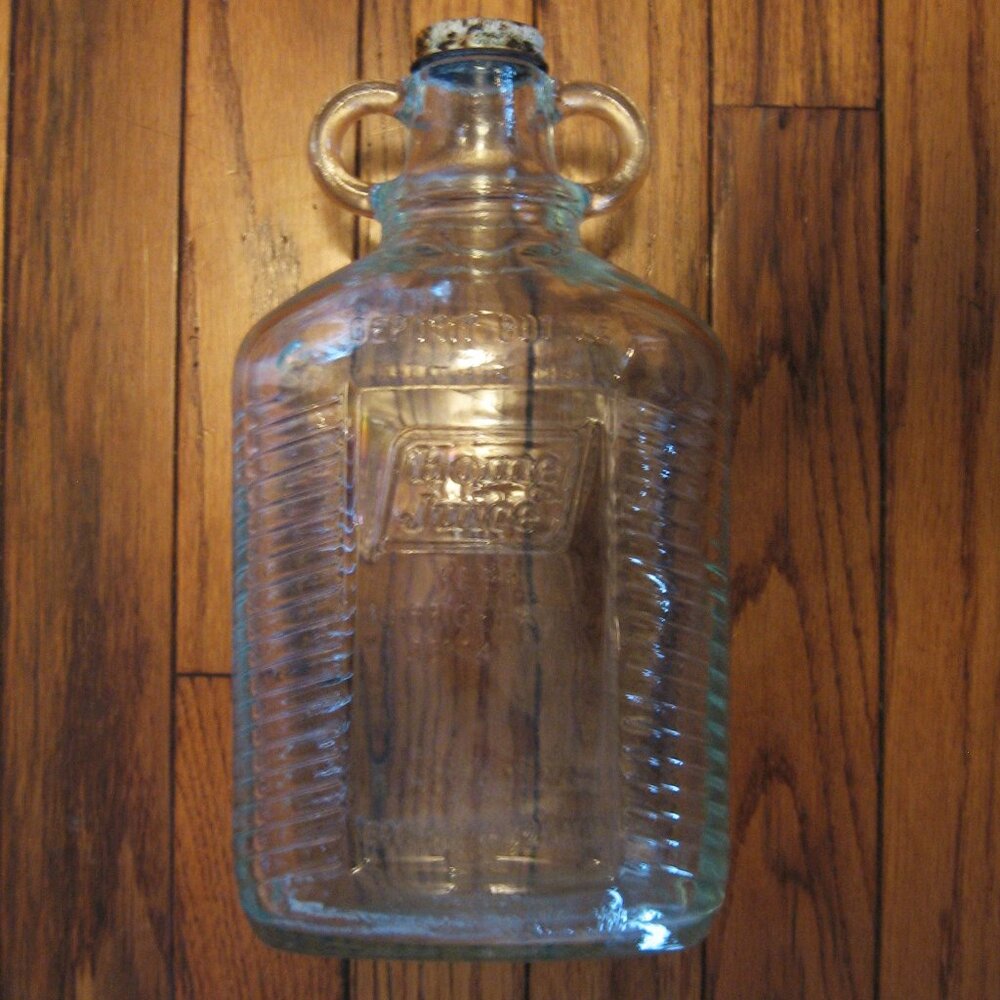 Vintage Home Juice CO. Strained Orange Juice Drink bottle with cap.